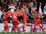 Dylan McGowan of United celebrates with his team mates after scoring during the round 22 A-League match between Adelaide United and Melbourne Victory at Coopers Stadium on March 21, 2015