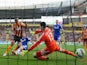 Ahmed Elmohamady of Hull City (27) shoots past goalkeeper Thibaut Courtois of Chelsea to score their first goal during the Barclays Premier League match on March 22, 2015