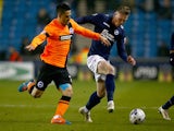 Aiden O'Brien of Millwall is challanged by Beram Kayal of Brighton & Hove Albion during the Sky Bet Championship match on March 17, 2015
