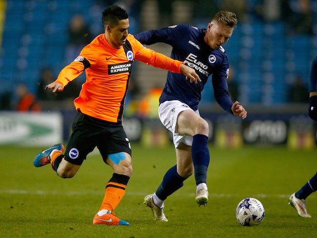 Aiden O'Brien of Millwall is challanged by Beram Kayal of Brighton & Hove Albion during the Sky Bet Championship match on March 17, 2015
