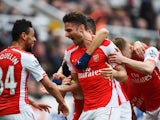 Olivier Giroud of Arsenal celebrates scoring his second goal with Francis Coquelin during the Barclays Premier League match between Newcastle United and Arsenal at St James' Park on March 21, 2015