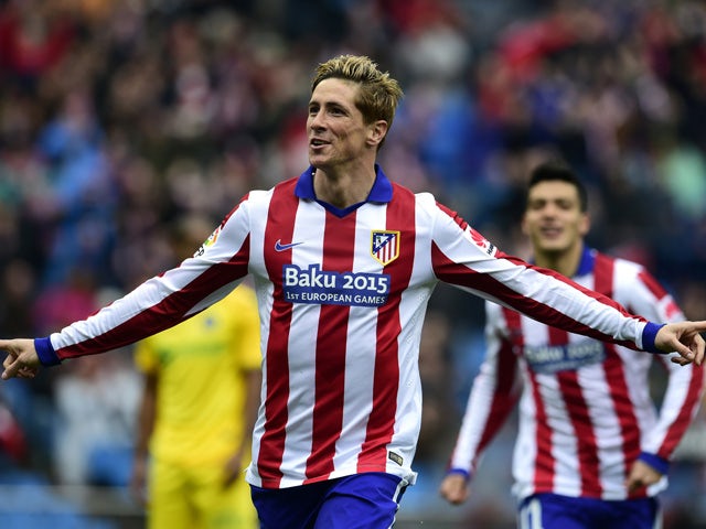 Atletico Madrid's forward Fernando Torres celebrates after scoring a goal during the Spanish league football match Club Atletico de Madrid vs Getafe CF at the Vicente Calderon stadium in Madrid on March 21, 2015
