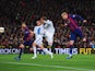 Jeremy Mathieu of Barcelona scores their first goal with a header during the La Liga match between FC Barcelona and Real Madrid CF at Camp Nou on March 22, 2015