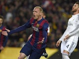 Barcelona's French defender Jeremy Mathieu celebrates after scoring a goal next to Real Madrid's defender Sergio Ramos during the 'clasico' Spanish league football match FC Barcelona vs Real Madrid CF at the Camp Nou stadium in Barcelona on March 22, 2015