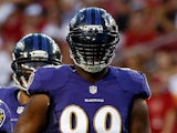 Defensive end Chris Canty #99 of the Baltimore Ravens lines up against the Tampa Bay Buccaneers during a preseason game at Raymond James Stadium on August 8, 2013