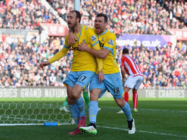 Glenn Murray of Crystal Palace celebrates scoring their first goal from the penalty spor with James McArthur of Crystal Palace during the Barclays Premier League match between Stoke City and Crystal Palace at Britannia Stadium on March 21, 2015