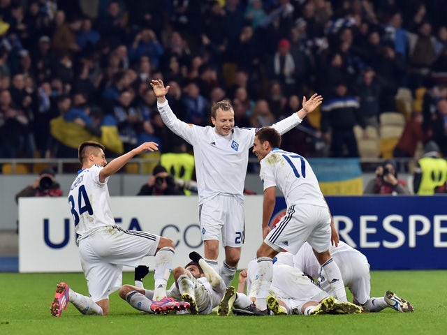 Players of FC Dynamo Kiev celebrate after scoring during the UEFA Europa League round of 16 football match between Dynamo Kiev and Everton in Kiev on March 19, 2015
