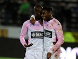Evian's French forward Clarck NSikulu celebrates with Evian's Senegalese forward Modou Sogou after scoring a goal during the French L1 football match between Evian and Montpellier on march 21, 2015