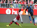 Monaco's defender Fabio Tavares (R) scores a goal next to Reims' Congolese defender Prince Oniangue (L) during the French Football match between Reims and Monaco, on March 22, 2015 