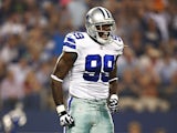 George Selvie #99 of the Dallas Cowboys celebrates after sacking the quarterback during a game against the New York Giants at AT&T Stadium on September 8, 2013