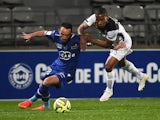 Bastia's forward Gael Danic vies with Guingamp's French midfielder Claudio Beauvue during the French L1 football match Bastia vs Guingamp, on March 21, 201