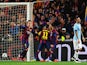 Ivan Rakitic of Barcelona (L) celebrates scoring the opening goal with Neymar and Luis Suarez of Barcelona during the UEFA Champions League Round of 16 second leg match against Manchester City on March 18, 2015