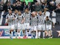 Juventus' Argentinian forward Alberto Carlos Tevez celebrates with teammates after scoring during the Italian Serie A football match Juventus Vs Genoa on March 22, 2015