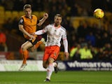 Kevin Doyle of Wolverhampton alongside Nikolay Bodurov of Fulham during the Sky Bet Championship match between Wolverhampton Wanderers and Fulham at Molineux on February 24, 2015