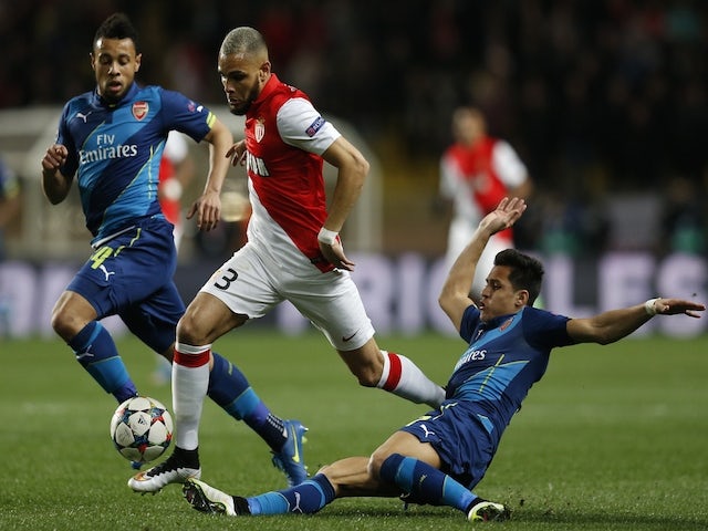 Monaco's French defender Layvin Kurzawa (C) is tackled by Arsenal's Chilean striker Alexis Sanchez (R) during the UEFA Champions League football match Monaco vs Arsenal, on March 17, 2015
