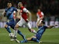 Monaco's French defender Layvin Kurzawa (C) is tackled by Arsenal's Chilean striker Alexis Sanchez (R) during the UEFA Champions League football match Monaco vs Arsenal, on March 17, 2015