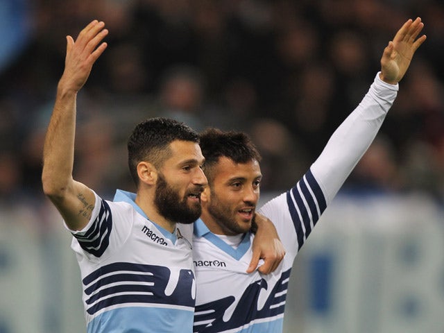 Felipe Anderson with his teammate Antonio Candreva (L) of SS Lazio celebrates after scoring the opening goal during the Serie A match between SS Lazio and Hellas Verona FC at Stadio Olimpico on March 22, 2015
