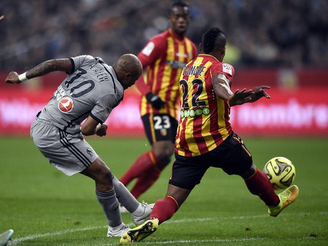 Marseille's Ghanaian forward Andre Ayew vies with Lens' French defender Loick Landre during the French L1 football match between Lens and Marseille on March 22, 2014