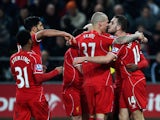 Jordan Henderson of Liverpool celebrates the opening goal with team mates during the Barclays Premier League match between Swansea City and Liverpool at Liberty Stadium on March 16, 2015