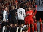 Liverpool's English midfielder Steven Gerrard is shown a red card by referee Martin Atkinson (2nd L) in the first minute of the second half, after coming on as substitute at half time in the English Premier League football match between Liverpool and Manc