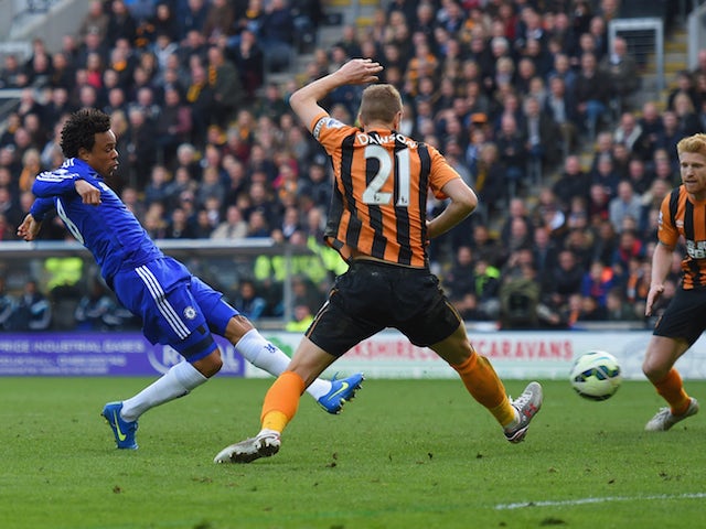 Loic Remy of Chelsea (L) beats Michael Dawson of Hull City (21) to score their thrid goal during the Barclays Premier League match on March 22, 2015