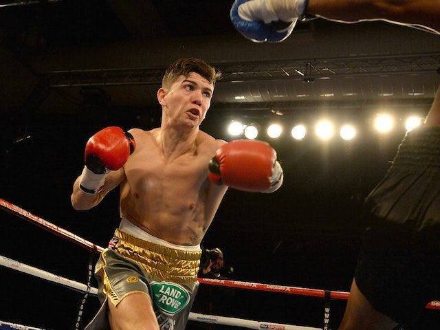 Luke Campbell (L) in action against Levis Morales during their Lightweight contest at The Hull Arena on March 7, 2015 in Hull, England