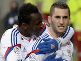 Lyon's French midfielder Maxime Gonalons is congratulated by a teammate after scoring a goal during the French L1 football match between Lyon and Nice on March 21, 2015