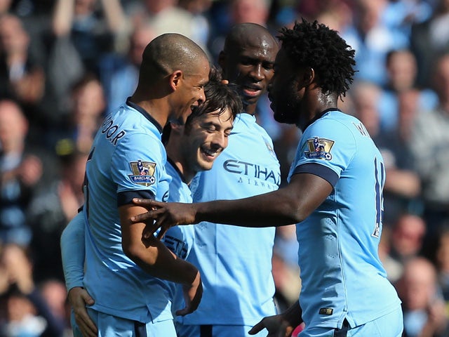 David Silva of Manchester City celebrates scoring their third goal with team mates during the Barclays Premier League match between Manchester City and West Bromwich Albion at Etihad Stadium on March 21, 2015