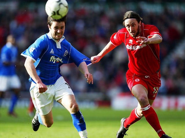 Jonathan Greening of Middlesbrough is tackled by Damien Johnson of Birmingham City during the FA Barclaycard Premiership match between Middlesbrough and Birmingham City at The Riverside Stadium on March 20, 2004