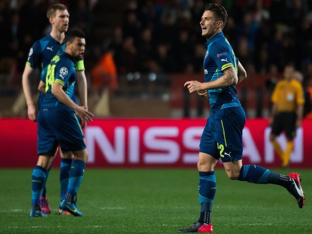 Arsenal's French striker Olivier Giroud celebrates after scoring a goal during the UEFA Champions League football match Monaco vs Arsenal, on March 17, 2015