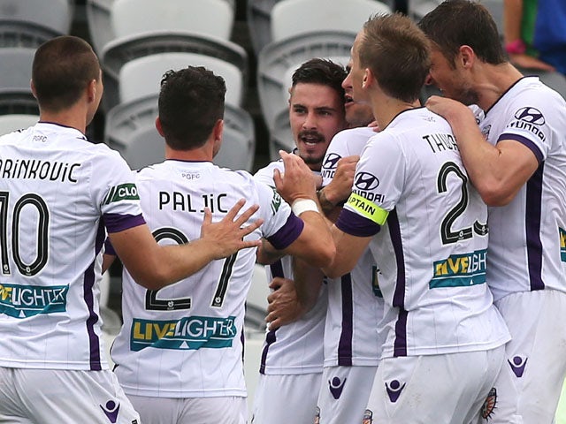 Jamie Maclaren of the Glory celebrates a goal with team mates during the round 22 A-League match between the Central Coast Mariners and the Perth Glory at Central Coast Stadium on March 22, 2015