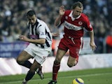 Ray Parlour of Middlesbrough slips past Neil Clement of West Bromwoich Albion during the Barclays Premiership match between West Bromwich and Middlesbrough at The Hawthorns on November 14, 2004