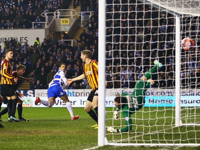 Hal Robson-Kanu of Reading heads the opening goal during the FA Cup Quarter Final Replay match between Reading and Bradford City at Madejski Stadium on March 16, 2015