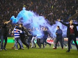 Reading fans celebrate on the pitch after the FA Cup Quarter Final Replay match between Reading and Bradford City at Madejski Stadium on March 16, 2015