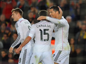 Cristiano Ronaldo of Real Madrid CF celebrates with Daniel Carvajal as he scores their first and equalising goal during the La Liga match between FC Barcelona and Real Madrid CF at Camp Nou on March 22, 2015