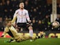 Ross McCormack of Fulham shoots past Gaetano Berardi of Leeds United during the Sky Bet Championship match between Fulham and Leeds United at Craven Cottage on March 18, 2015