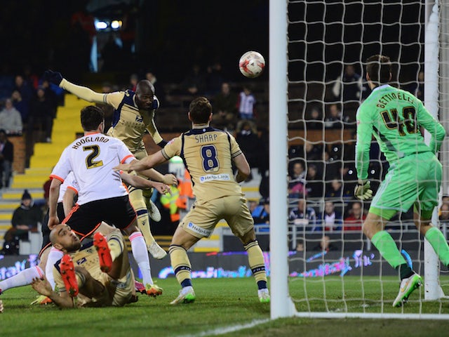 Sol Bamba of Leeds United (C) scores their second goal past goalkeeper Marcus Bettinelli of Fulham during the Sky Bet Championship match on March 18, 2015