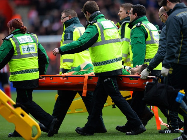 Fraser Forster of Southampton is stretched off the pitch after picking up an injury during the Barclays Premier League match between Southampton and Burnley at St Mary's Stadium on March 21, 2015