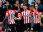 Shane Long of Southampton celebrates with team-mates after scoring the opening goal during the Barclays Premier League match between Southampton and Burnley at St Mary's Stadium on March 21, 2015