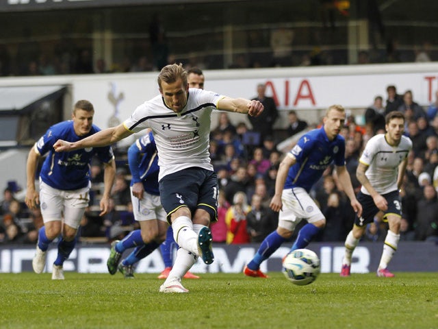 Tottenham Hotspur's English striker Harry Kane scores his third goal, from the penalty spot during the English Premier League football match between Tottenham Hotspur and Leicester City at White Hart Lane in London on March 21, 2015