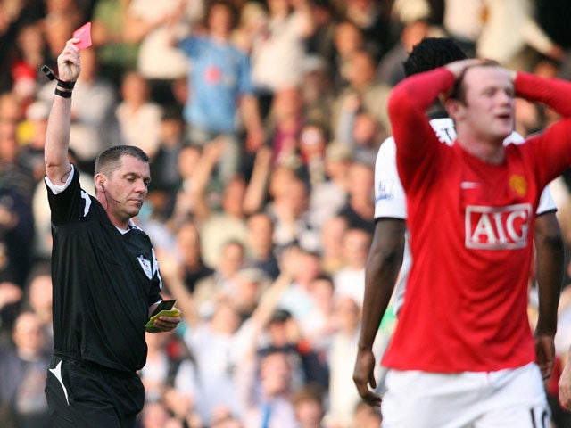 Manchester United's Wayne Rooney is sent off by referee Phil Dowd for receiving a second yellow card during the Premier League football match between Fulham and Manchester United at Craven Cottage in London, on March 21, 2009