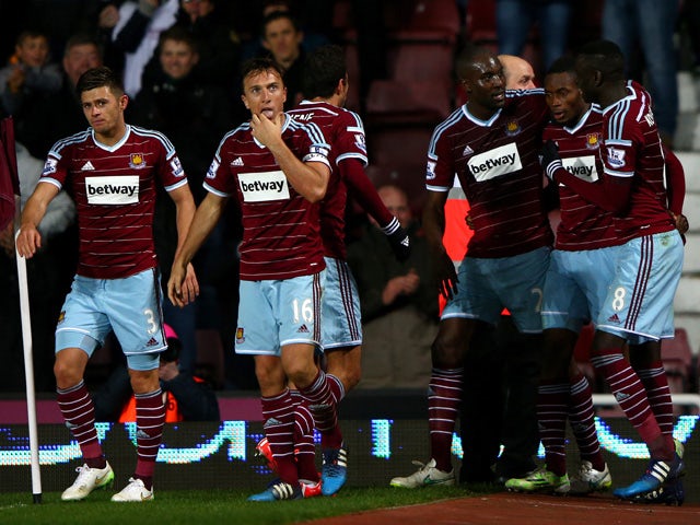 Diafra Sakho of West Ham celebrates with team-mates after scoring the winning goal during the Barclays Premier League match between West Ham United and Sunderland at Boleyn Ground on March 21, 2015