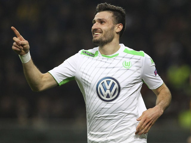Daniel Caligiuri of VfL Wolfsburg celebrates after scoring the opening goal during the UEFA Europa League Round of 16 match between FC Internazionale Milano and VfL Wolfsburg at Stadio Giuseppe Meazza on March 19, 2015