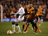 Tom Ince of Derby is challenged by Nouha Dicko of Wolves during the Sky Bet Championship match between Wolverhampton Wanderers and Derby County at Molineux on March 20, 2015