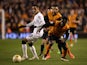 Tom Ince of Derby is challenged by Nouha Dicko of Wolves during the Sky Bet Championship match between Wolverhampton Wanderers and Derby County at Molineux on March 20, 2015