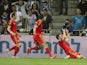 Wales' midfielder Aaron Ramsey (R) points to the sky in celebration of his goal during the Euro 2016 qualifying football match between Israel and Wales at the Sammy Ofer Stadium in the Israeli coastal city of Haifa, on March 28, 2015