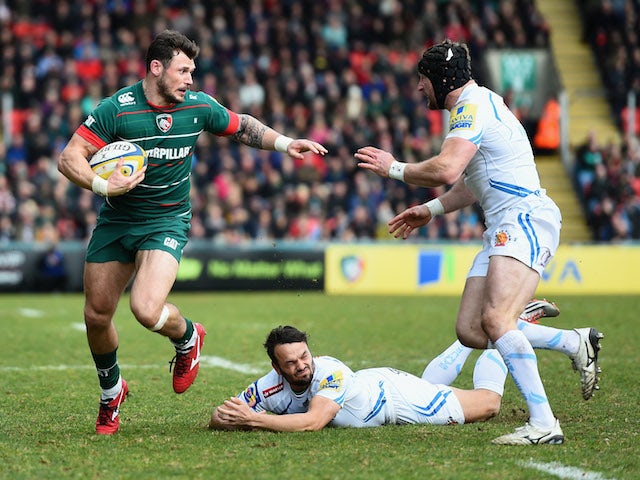 Adam Thompstone of Leicester Tigers is tackled by Phil Dollman and Matt Jess of Exeter Chiefs during the Aviva Premiership match between Leicester Tigers and Exeter Chiefs at Welford Road on March 28, 2015
