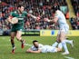 Adam Thompstone of Leicester Tigers is tackled by Phil Dollman and Matt Jess of Exeter Chiefs during the Aviva Premiership match between Leicester Tigers and Exeter Chiefs at Welford Road on March 28, 2015