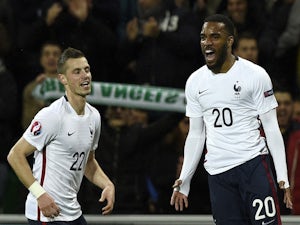 France's forward Alexandre Lacazette (R) celebrates next to midfielder Morgan Schneiderlin after scoring a goal during a friendly football match between France and Denmark at the Geoffroy-Guichard stadium in Saint-Etienne on March 29, 2015