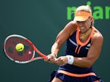 Angelique Kerber of Germany plays a backhand against Heather Watson of Great Britain in their second round match during the Miami Open Presented by Itau at Crandon Park Tennis Center on March 28, 2015